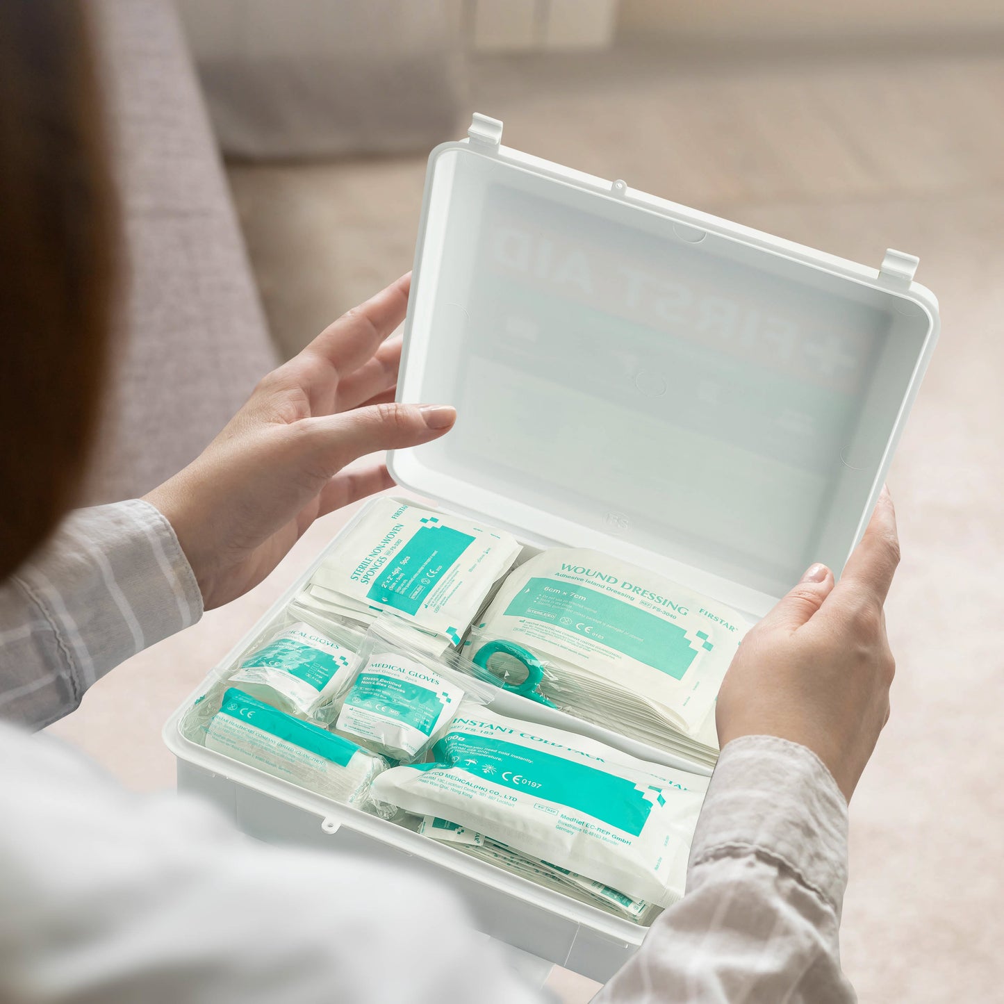 First Aid Kit on lap with lady