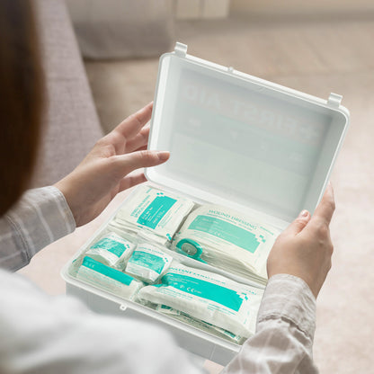 First Aid Kit on lap with lady